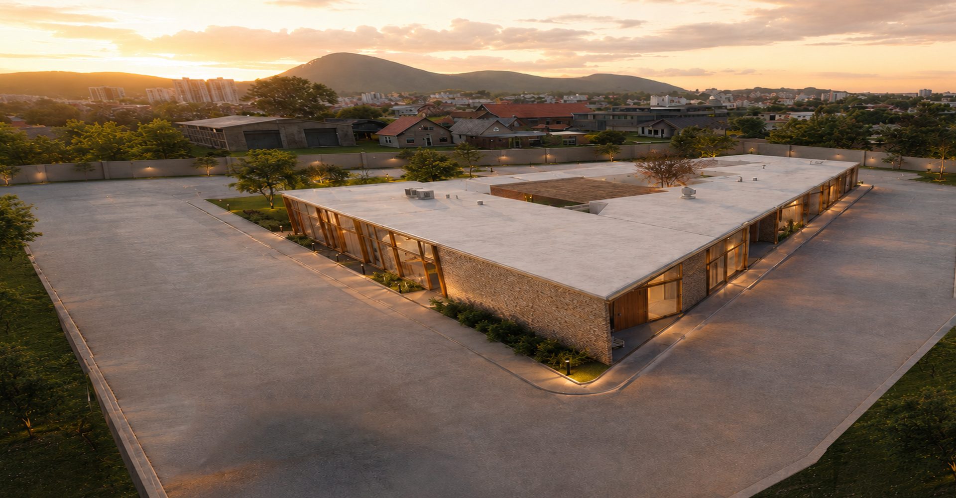 Vista aérea de Monteluz al atardecer: 10 villas alrededor del patio central